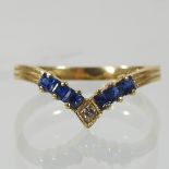 An 18 carat gold sapphire and diamond v shaped ring,