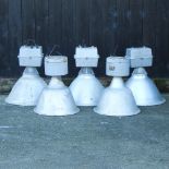 A collection of five industrial metal ceiling lights,