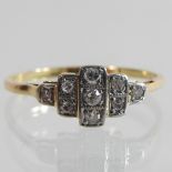 An Art Deco style unmarked diamond cluster ring,