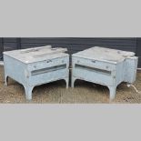 A pair of galvanized incubators,