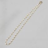 A cultured pearl single strand necklace, with a gold plated clasp,