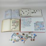 A collection of stamps and stamp albums