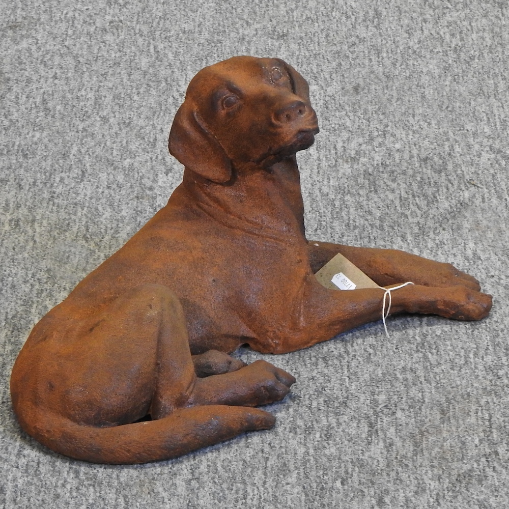 A rusted cast iron model of a dog,