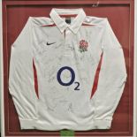 A 2003 Rugby World Cup shirt, various signed by the team players, in a glazed display frame,