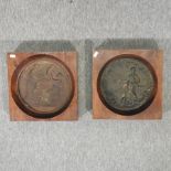 A pair of bronze relief plaques of figures, each mounted in a wooden frame,