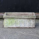 A reconstituted stone garden planter,