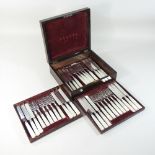 A set of eighteen Victorian silver plated dessert knives and forks, with mother of pearl handles,