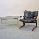 A 1970's style black leather upholstered Danish lounge chair, in the manner of Oddvin Rykken,