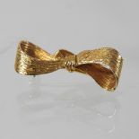 A 9 carat gold brooch, in the form of a bow,