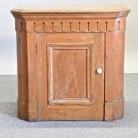 A Victorian pine cupboard,