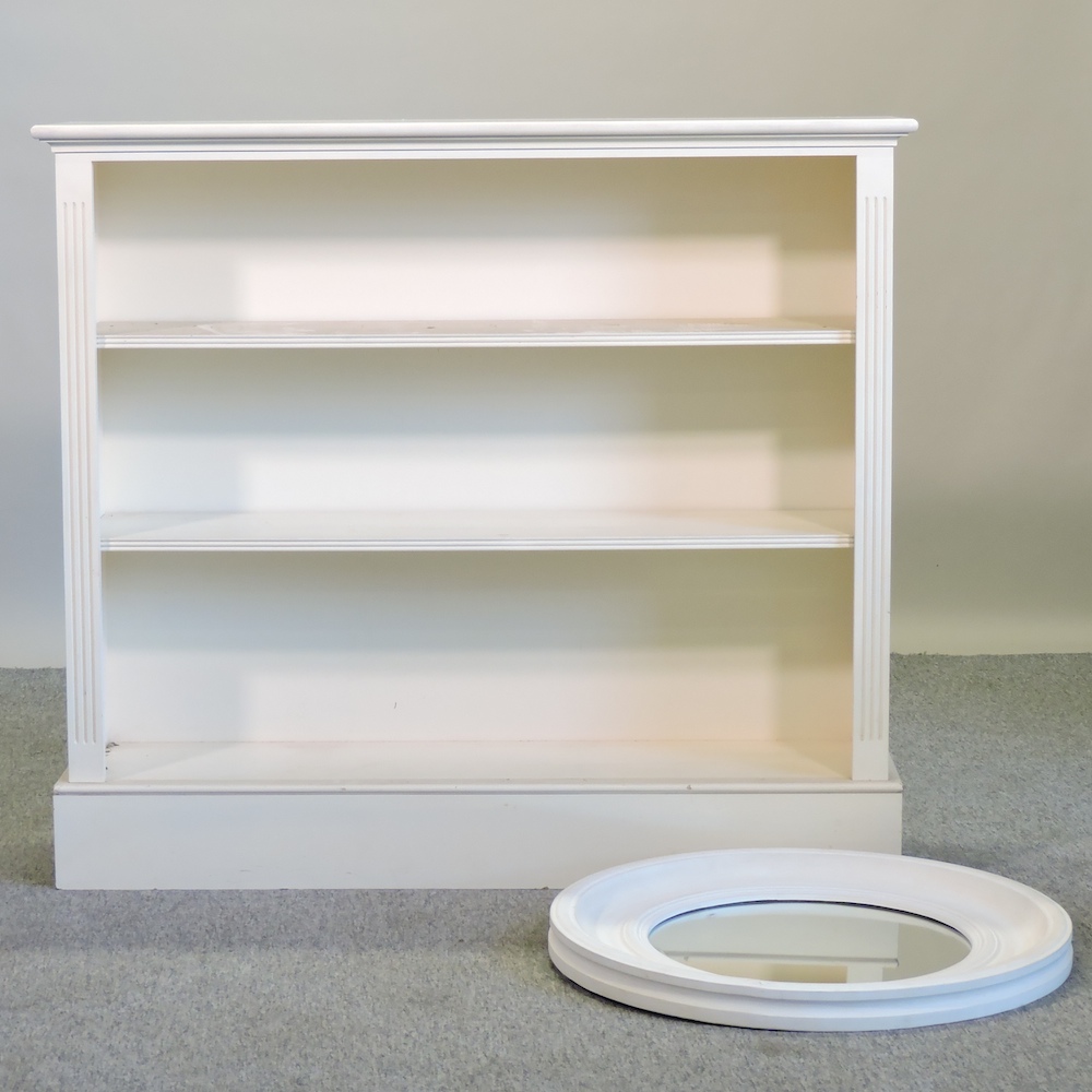 A cream painted dwarf open bookcase, 122cm,