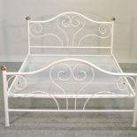 A modern white painted metal bedstead, with a sprung base,