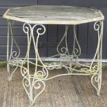 An octagonal garden table, on an iron base,