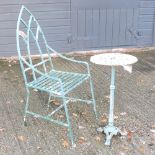 A gothic style garden armchair, together with a similar occasional table,