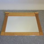 A Regency style gilt painted over mantel mirror, with reeded decoration,