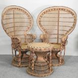 A pair of large 1970's wicker peacock armchairs,