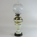 A 19th century French opaline glass oil lamp, with an etched glass shade,