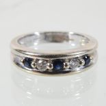An 18 carat gold sapphire and diamond half hoop eternity ring,