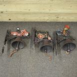 A set of three novelty painted metal door bells, in the form of a steam engine,