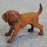 A rusted cast iron model of a puppy,