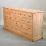 A pine merchant's chest, containing an arrangement of drawers,