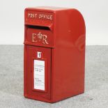 A red painted GPO style postbox,