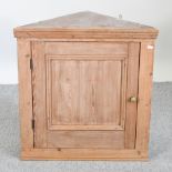 A Victorian pine hanging corner cupboard,