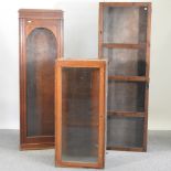 An early 20th century narrow glazed display cabinet, 59cm,