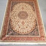 A Keshan style carpet, with floral design on a beige ground,