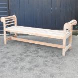 A Lutyens style teak garden seat,