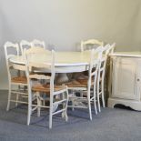 A French cream painted extending dining table, with two additional leaves, 213 x 114cm overall,