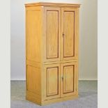 A French yellow painted pine cupboard,