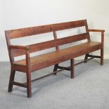 An early 20th century pitch pine bench,