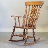 A beech splat back rocking chair