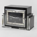 An Art Deco black painted and chrome mounted mantel clock,