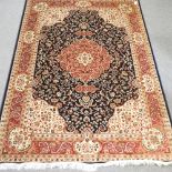 A Keshan style carpet, with floral design on a blue ground,