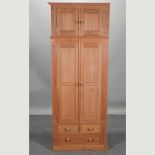 A modern pine double wardrobe,