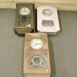 An antique wall clock, together with two others,