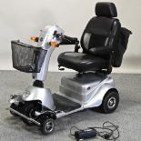 A silver AVC Quingo plus electric mobility scooter,
