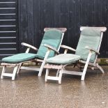 A pair of teak garden steamer chairs,