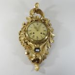 A continental carved giltwood wall clock,