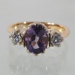 An 18 carat gold amethyst and diamond ring, boxed,