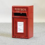 A GPO style red painted metal post box,