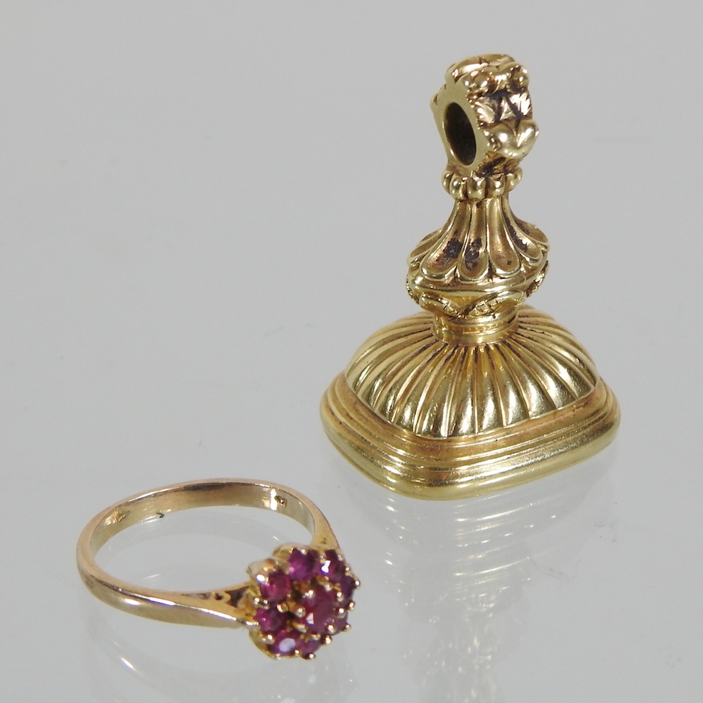 A 9 carat gold and garnet ring,
