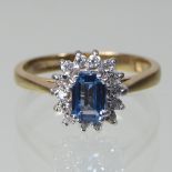 A 9 carat gold aquamarine and diamond cluster ring,