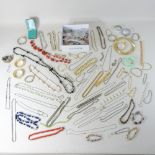 A box of costume jewellery necklaces and beads
