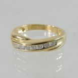 An 18 carat gold and diamond crossover eternity ring,