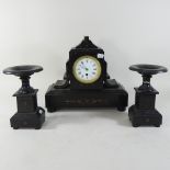 An early 20th century black slate clock garniture,