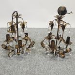 A pair of brass and crystal chandeliers,