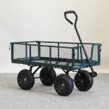 A green painted metal garden cart,